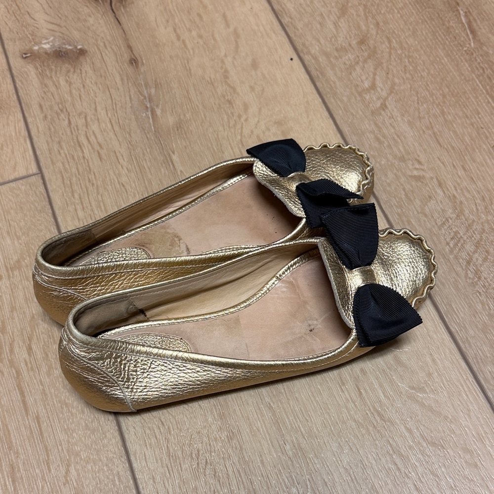 Kate Spade Gold Ballet Flats with Black Bow